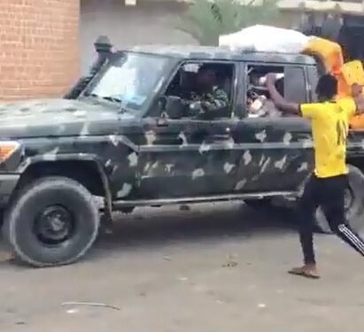 Kano Boys Drag Out Gallon Of Oil From Army Truck During Protest (Photos)