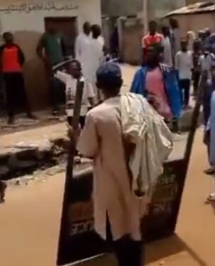 Man Captured Looting Police Signpost In Northern Nigeria (Photos)