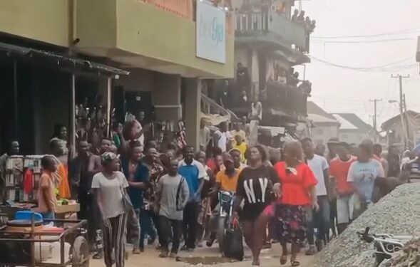 Aba Residents Publicly Humiliate Lady Over Her Dressing (Photos, Video)
