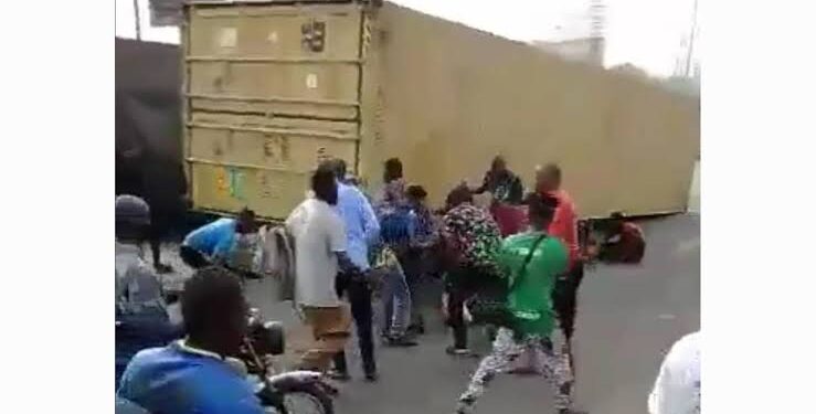 Driver Escapes Death As 40 Foot Container Falls On Car In Lagos
