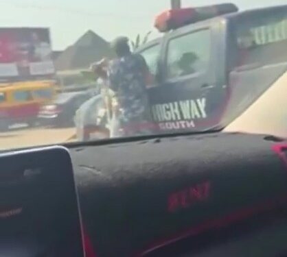 Lady Seen Beating A Police Officer In Roadside Fight (Video)