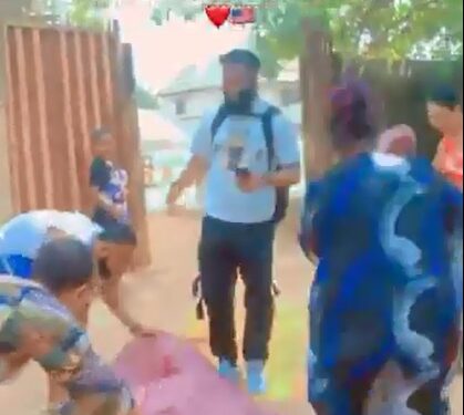 Mother Spreads Wrappers To Welcome Son After 11 Years Abroad