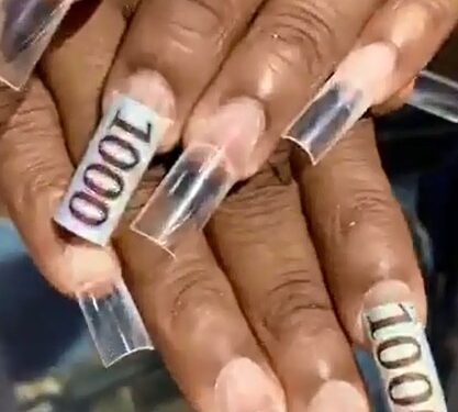 Lady Cuts ‘1000’ From ₦1K Notes To Decorate Her Nails, Sparks Outrage (Photos)