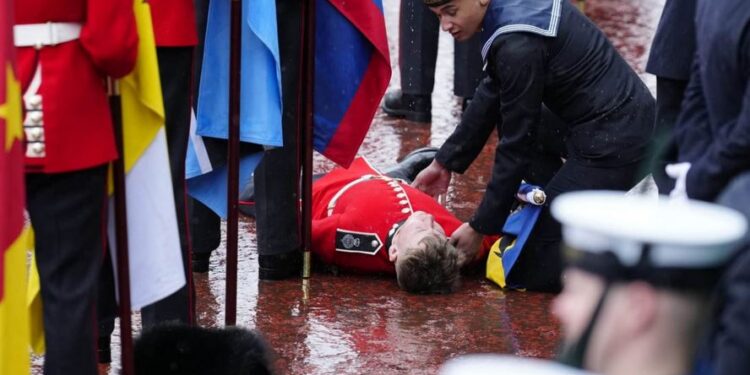 Flagbearer Slumps At King Charles Coronation