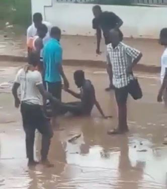The Moment Onlookers Rescued Man Trapped In Flood (Video)