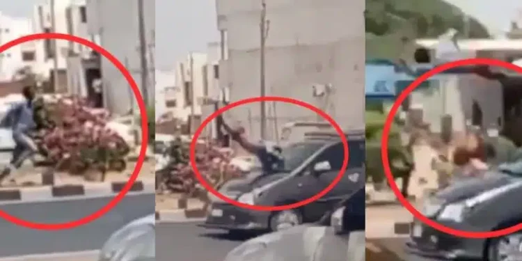 Nigerian man hijacks lady’s phone, gets hit by speeding car seconds later, video breaks the internet