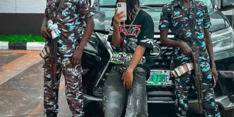 Outrage as internet big boy is spotted with policemen as his personal bodyguards