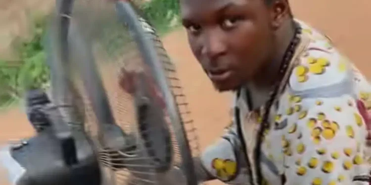 Nigerian man upgrades his motorcycle with standing fan, car gear, steering wheel (video)
