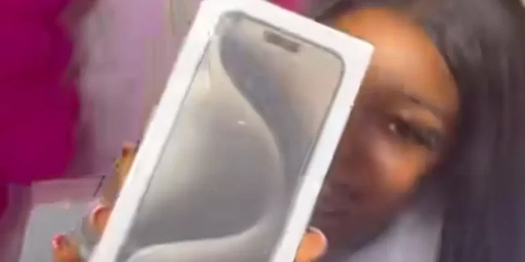 Nigerian lady celebrates 1st anniversary with brand new iPhone 15 Pro Max, ₦3 million cheque from Boyfriend
