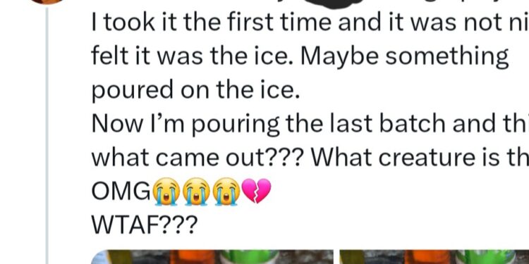Lady shows substance she found inside pack of grape juice