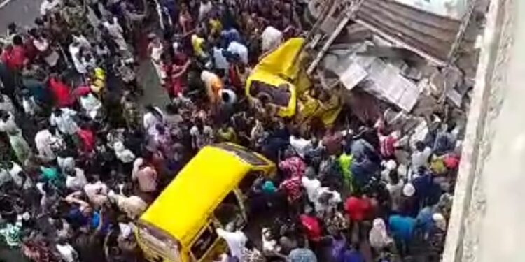 Truck falls off Pen Cinema Bridge, crushes two buses in Lagos (video)