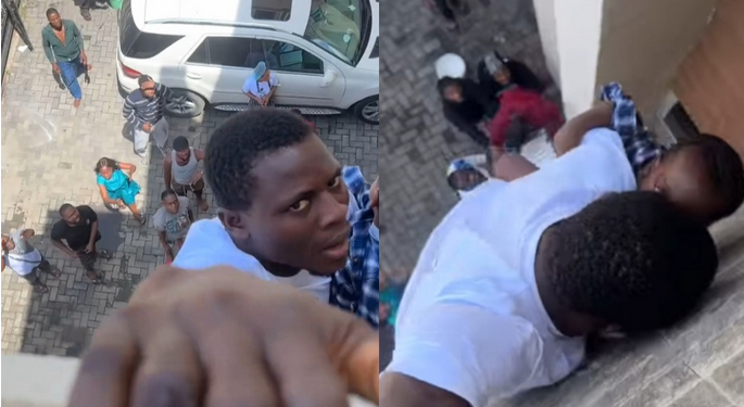 Man holds baby while hanging from balcony during house fire in Lagos (video)
