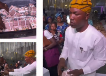 Man shuts down wedding reception as he sprays couple with bundles of N5 bills (video)