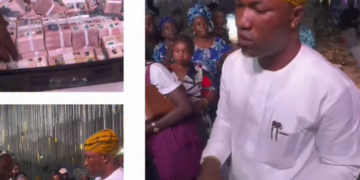 Man shuts down wedding reception as he sprays couple with bundles of N5 bills (video)