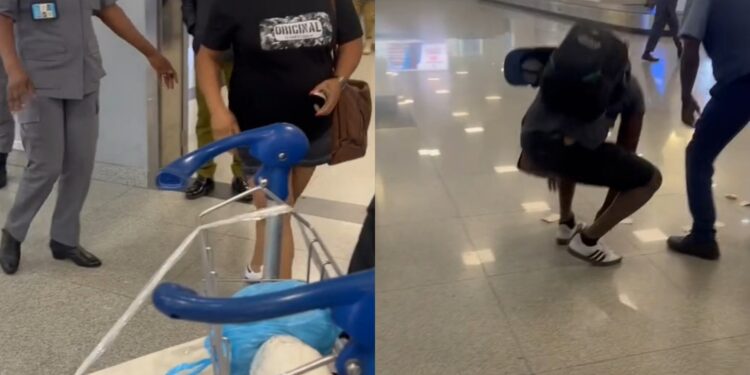 Woman destroys husband’s international passport as they arrive at the international airport in Lagos (video)
