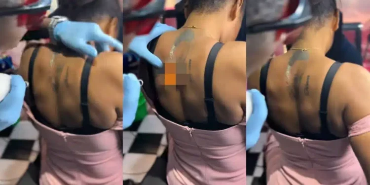 Lady endures pains as she removes boyfriend’s face she tattooed on her body
