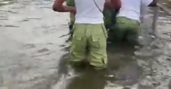 Lagos Corps Members Navigate Through Flooded Area To Attend CDS (Photos)