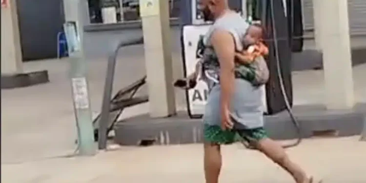 Mixed feelings as father backs baby while running errands