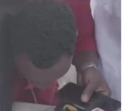 Thief captured on video stealing $100 during a burial ceremony