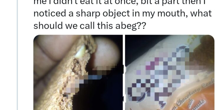 Woman shows object she found in biscuit she was eating