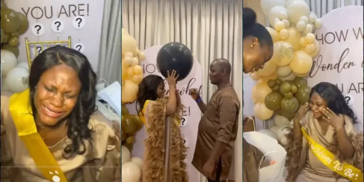Woman weeps as boss holds surprise baby shower for her at work