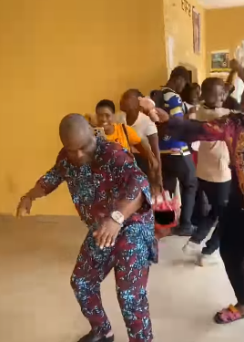 Trending video of Nigerian lecturer dancing with his students after class